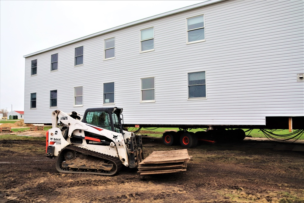 Contractors ‘drive’ World War II-era barracks buildings to new foundations at Fort McCoy