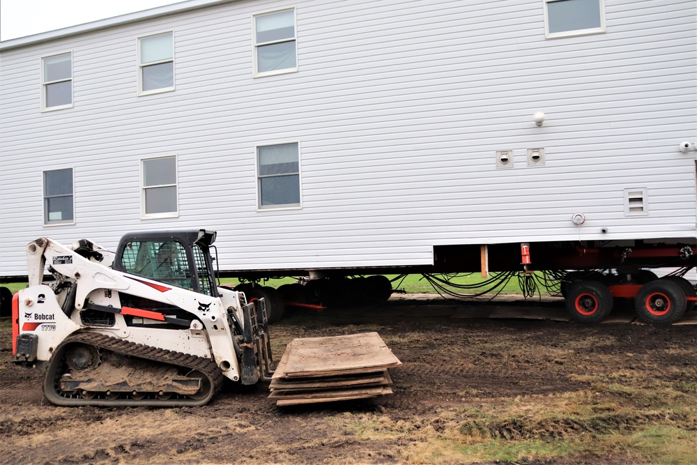 Contractors ‘drive’ World War II-era barracks buildings to new foundations at Fort McCoy