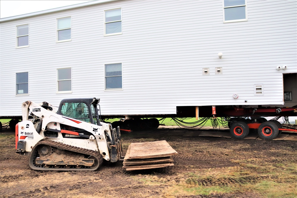 Contractors ‘drive’ World War II-era barracks buildings to new foundations at Fort McCoy