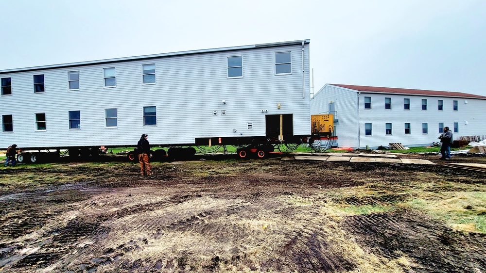 Contractors ‘drive’ World War II-era barracks buildings to new foundations at Fort McCoy