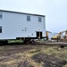 Contractors ‘drive’ World War II-era barracks buildings to new foundations at Fort McCoy