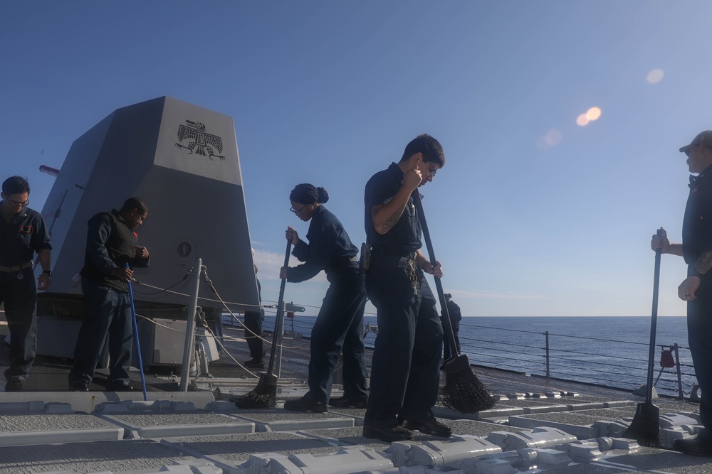 Sailors aboard the USS Rafael Peralta (DDG 115) conduct a freshwater wash down in the East China Sea