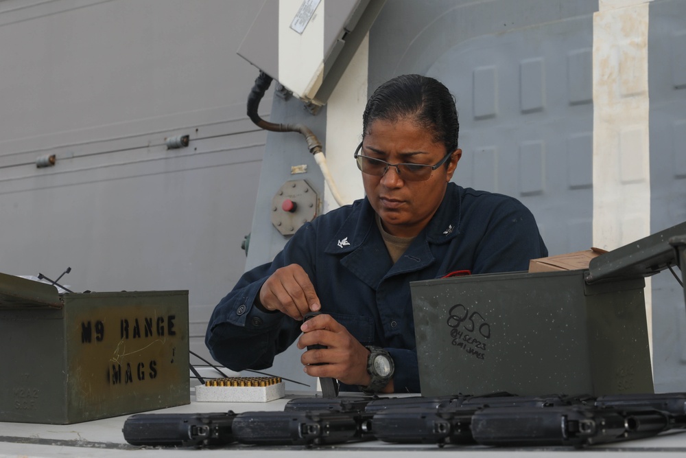 Sailors aboard the USS Rafael Peralta (DDG 115) conduct a small arms shoot in the East China Sea