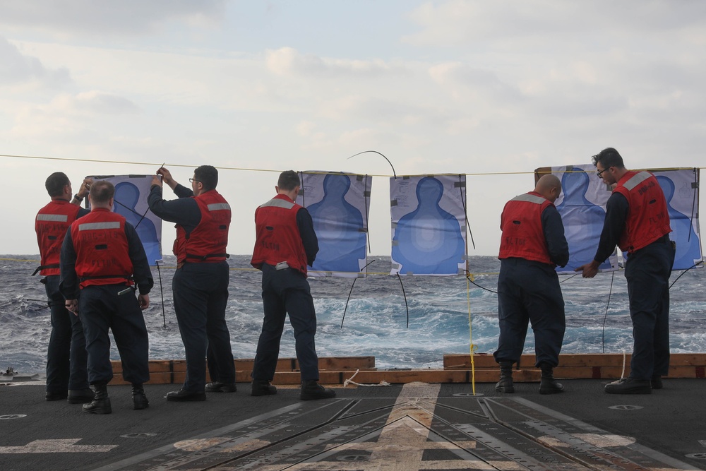 Sailors aboard the USS Rafael Peralta (DDG 115) conduct a small arms shoot in the East China Sea
