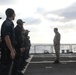Sailors aboard the USS Rafael Peralta (DDG 115) conduct a small arms shoot in the East China Sea