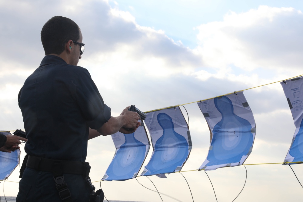 Sailors aboard the USS Rafael Peralta (DDG 115) conduct a small arms shoot in the East China Sea