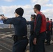 Sailors aboard the USS Rafael Peralta (DDG 115) conduct a small arms shoot in the East China Sea