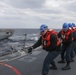 Sailors aboard the USS Rafael Peralta (DDG 115) conduct a replenishment-at-sea with the USNS Big Horn in the East China Sea