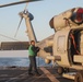 Sailors aboard the USS Rafael Peralta (DDG 115) conduct flight quarters in the East China Sea