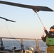 Sailors aboard the USS Rafael Peralta (DDG 115) conduct flight quarters in the East China Sea