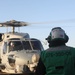 Sailors aboard the USS Rafael Peralta (DDG 115) conduct flight quarters in the East China Sea