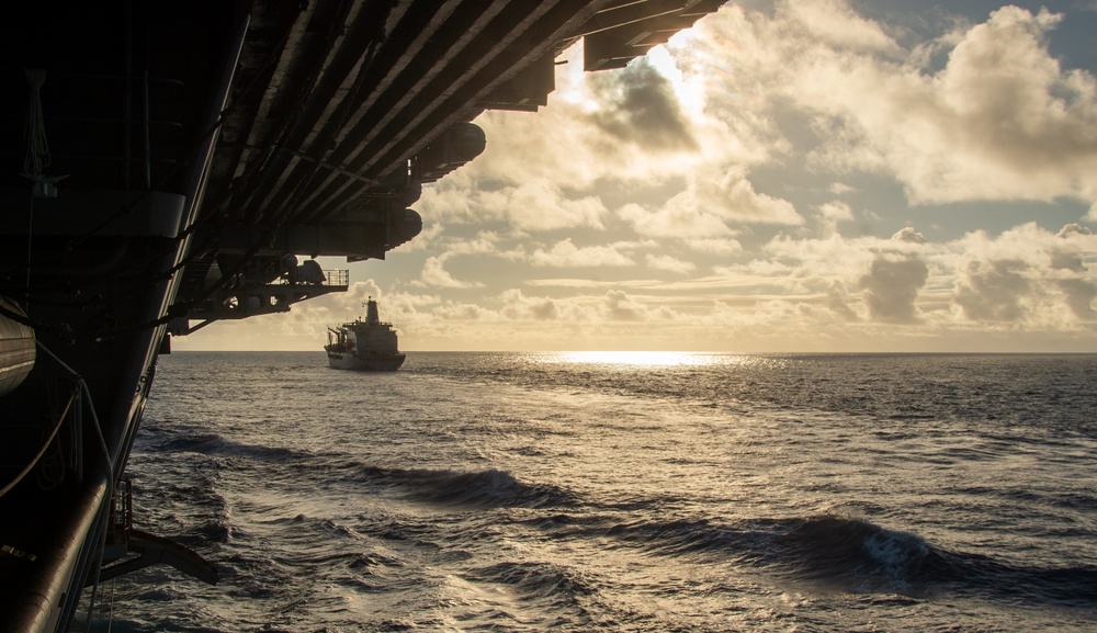 USS Ronald Reagan (CVN 76) conducts fueling-at-sea with USNS Big Horn (T-AO 198)