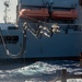 USS Ronald Reagan (CVN 76) conducts fueling-at-sea with USNS Big Horn (T-AO 198)