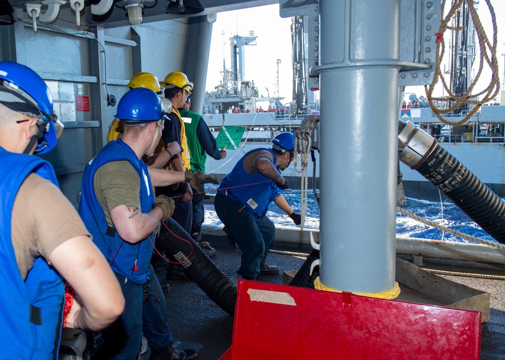 USS Ronald Reagan (CVN 76) conducts fueling-at-sea with USNS Big Horn (T-AO 198)