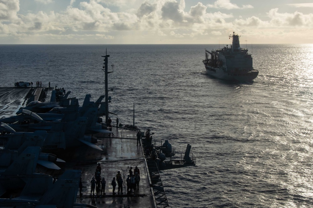 USS Ronald Reagan (CVN 76) conducts fueling-at-sea with USNS Big Horn (T-AO 198)