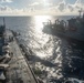 USS Ronald Reagan (CVN 76) conducts fueling-at-sea with USNS Big Horn (T-AO 198)