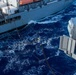 USS Ronald Reagan (CVN 76) conducts fueling-at-sea with USNS Big Horn (T-AO 198)