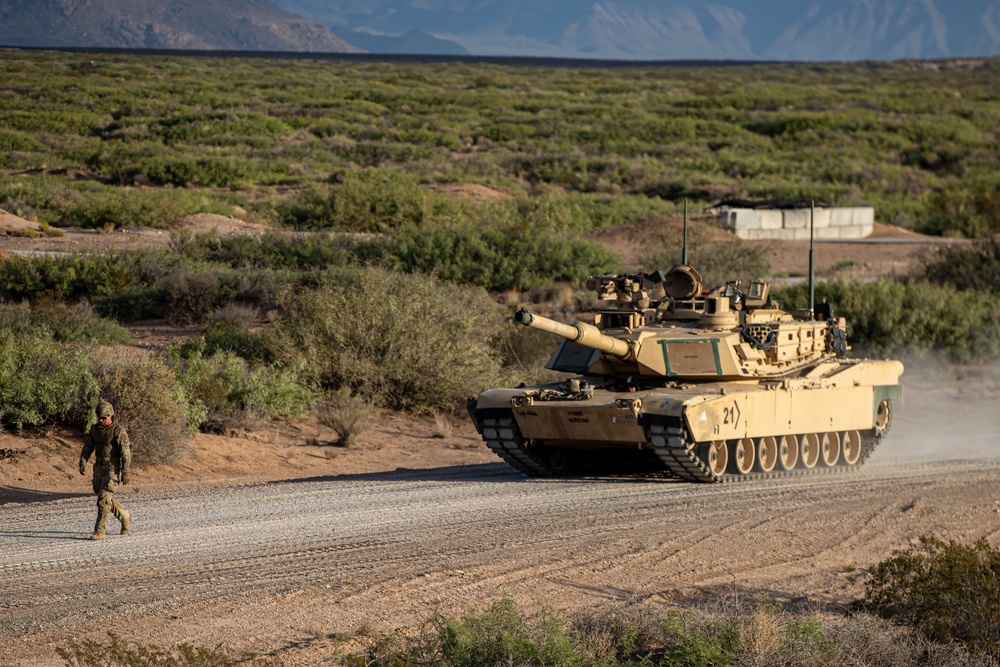 U.S. Army Soldier ground guides M1 Abrams