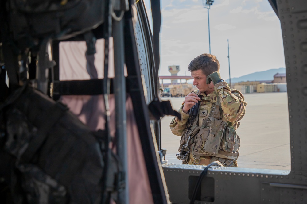 U.S. Army Door Gunner inserts ear protection