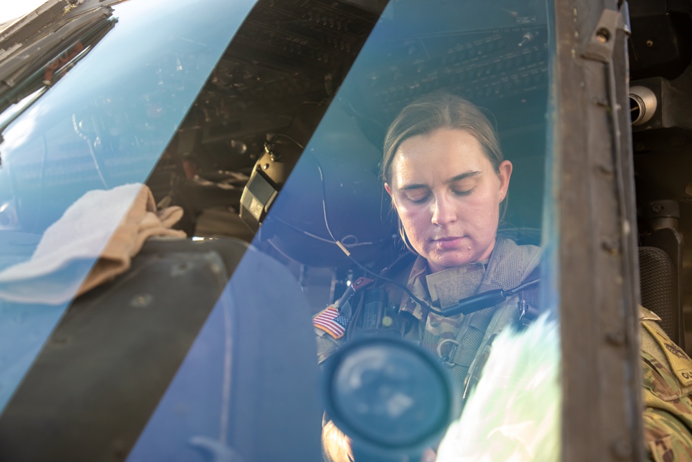 U.S. Army Pilot conducts pre-flight checks