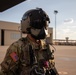 U.S. Army Crew Chief conducts pre-flight checks