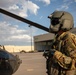 U.S. Army Door Gunner conducts pre-flight checks