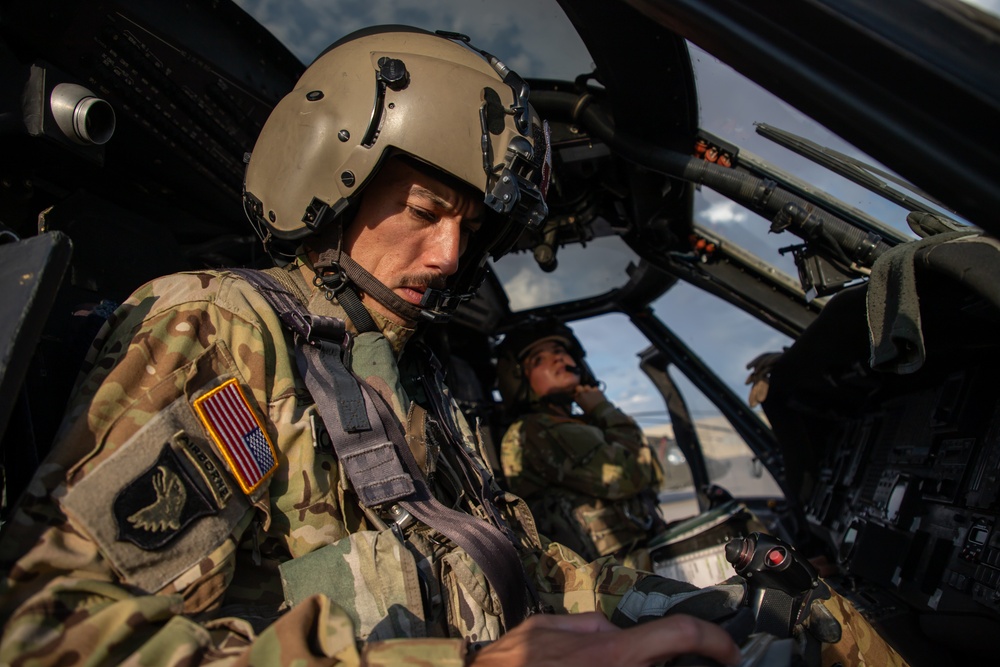 U.S. Army Pilots conduct pre-flight checks