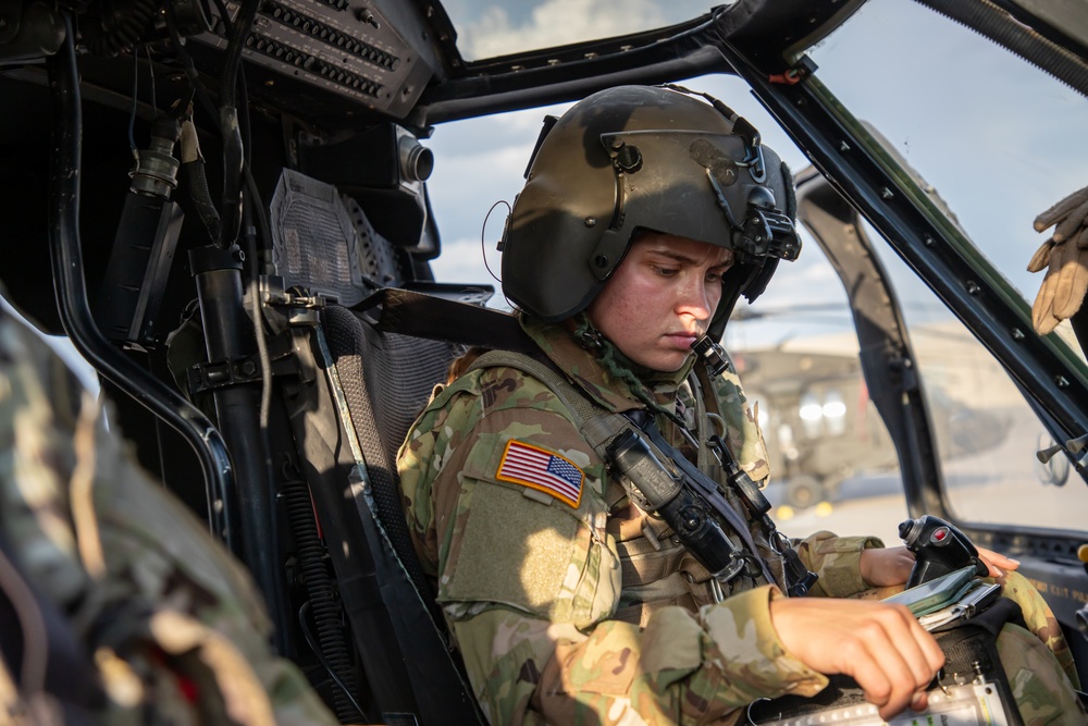 U.S. Army Pilot conducts pre-flight checks