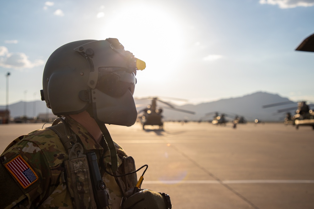 U.S. Army Door Gunner conducts pre-flight checks