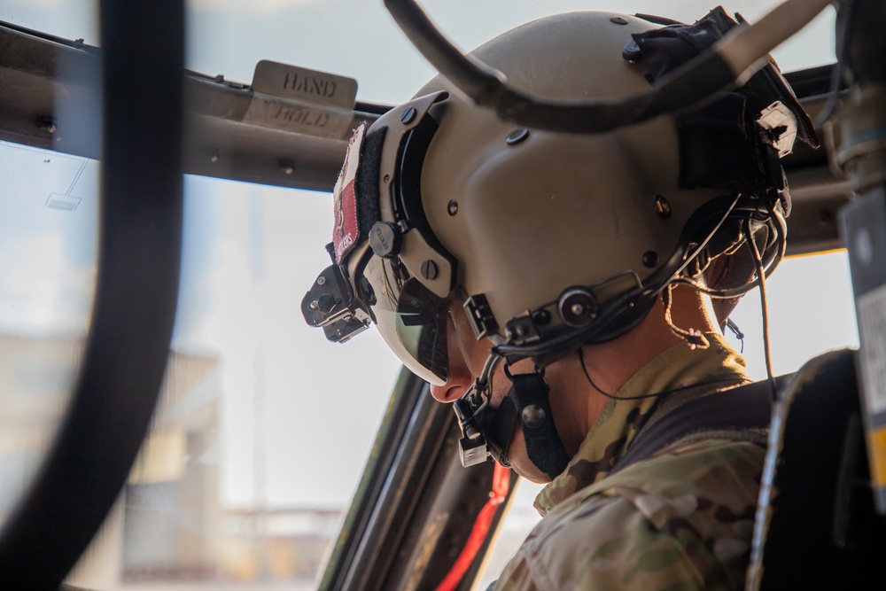 U.S. Army Pilot conduct pre-flight checks