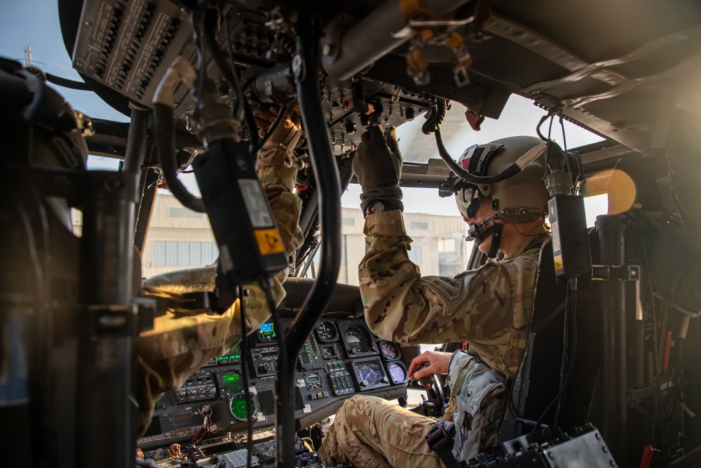 U.S. Army Pilots conduct pre-flight checks