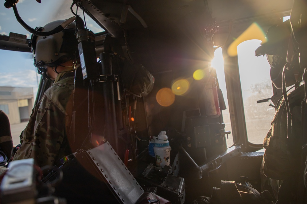 U.S. Army UH-60M Black Hawk crew prepare for take off