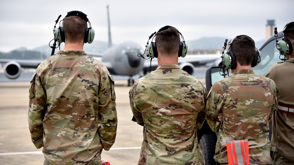 117th AMXS crew chiefs stand by to taxi KC-135 Stratotanker