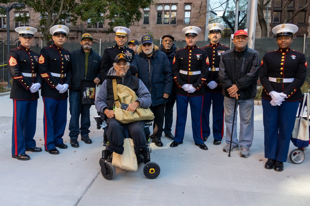 U.S. Marines conduct flag raising ceremony for locale community