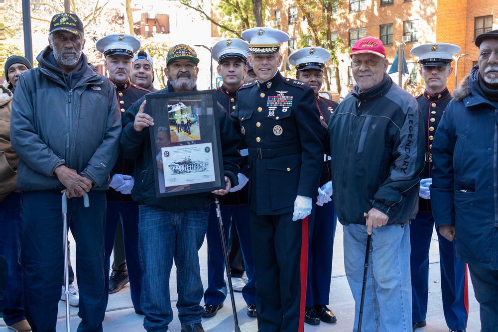 U.S. Marines conduct flag raising ceremony for locale community