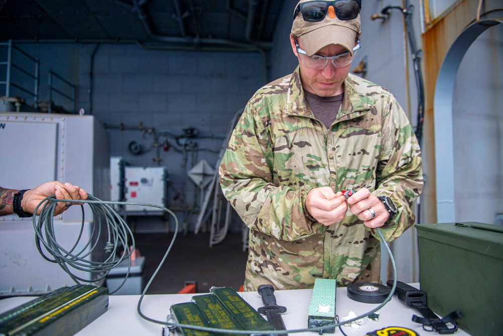 U.S. Navy Explosive Ordnance Disposal Technicians Conduct Demolition Build-Up