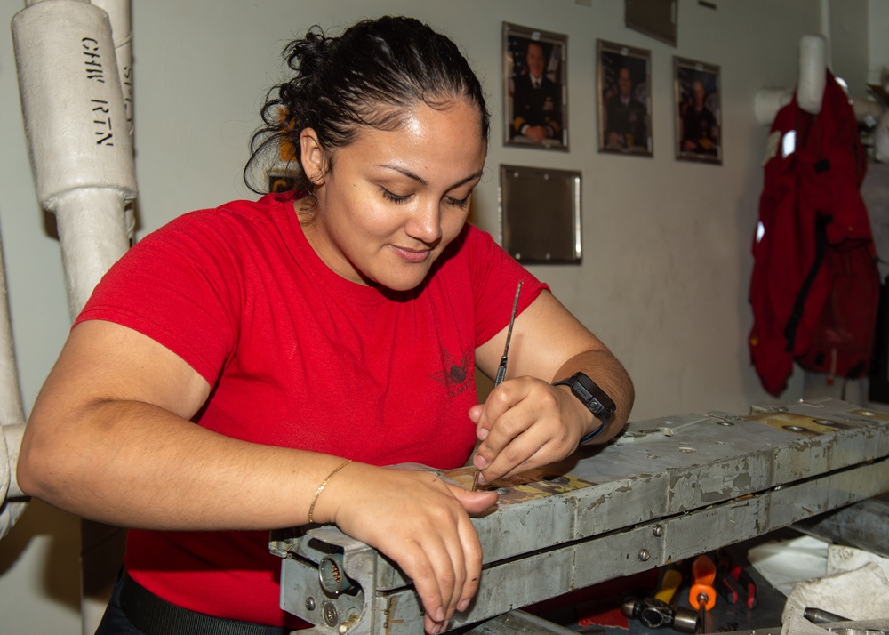 USS Ronald Reagan (CVN 76) Sailors perform aircraft maintenance
