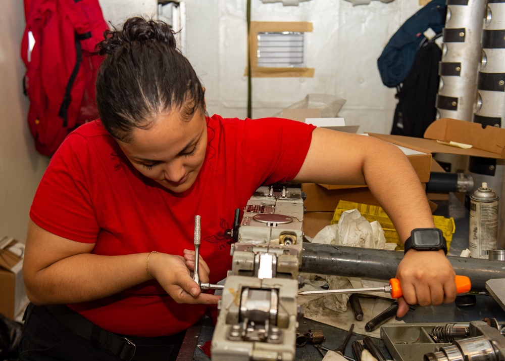 USS Ronald Reagan (CVN 76) Sailors perform aircraft maintenance
