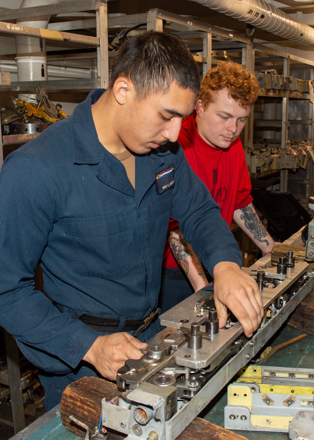 USS Ronald Reagan (CVN 76) Sailors perform aircraft maintenance