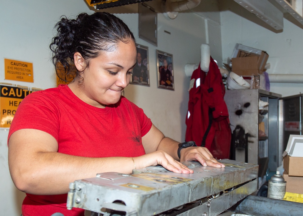 USS Ronald Reagan (CVN 76) Sailors perform aircraft maintenance
