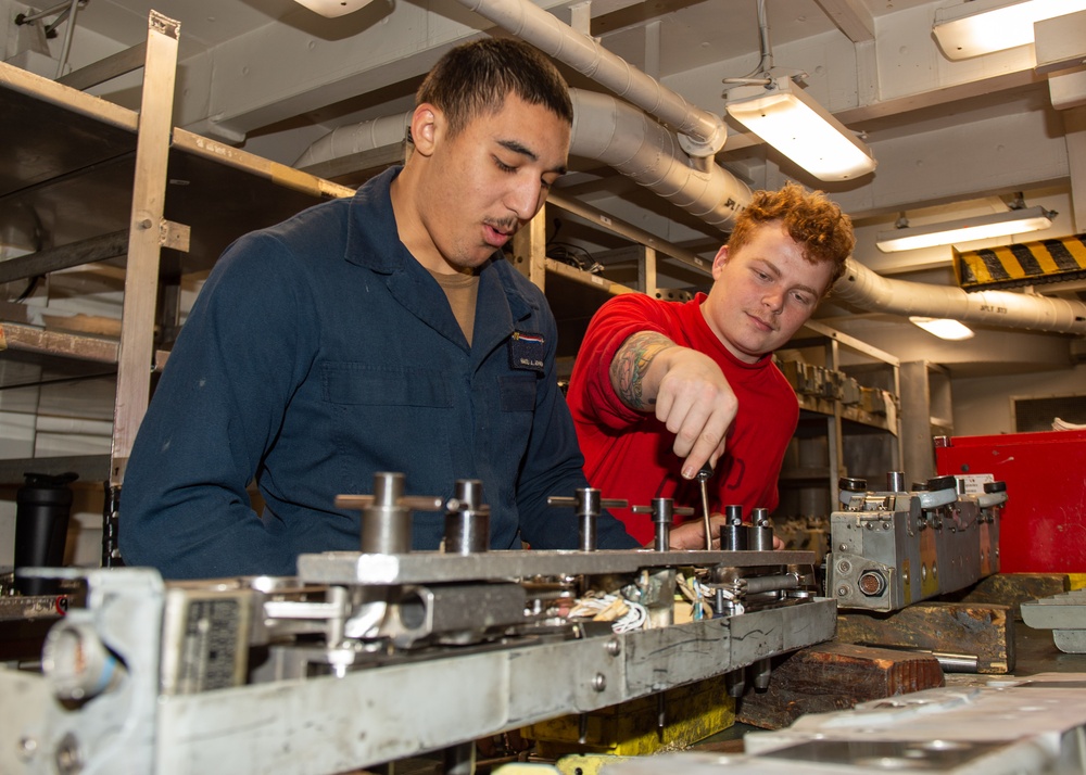 USS Ronald Reagan (CVN 76) Sailors perform aircraft maintenance