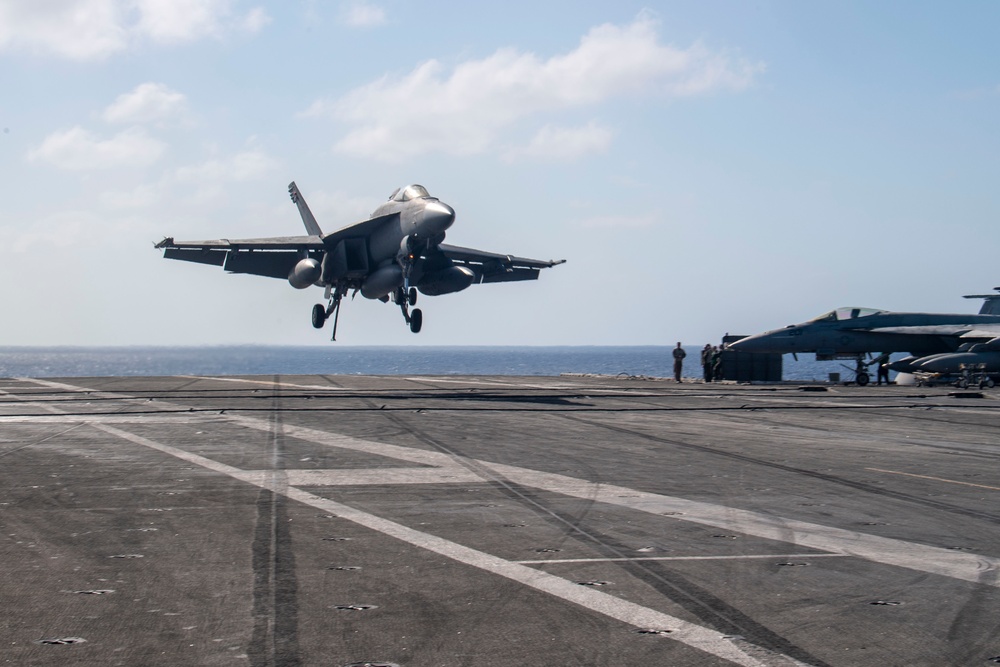 USS Ronald Reagan (CVN 76) conducts flight operations in support of a multi large-deck event with USS Carl Vinson (CVN 70) and Japanese Maritime Self-Defense Force First-in-class helicopter destroyer JS Hyuga (DDH 181)