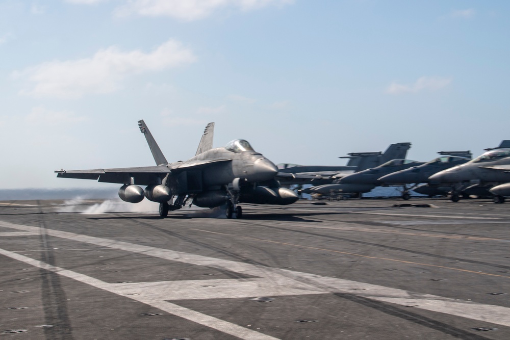 USS Ronald Reagan (CVN 76) conducts flight operations in support of a multi large-deck event with USS Carl Vinson (CVN 70) and Japanese Maritime Self-Defense Force First-in-class helicopter destroyer JS Hyuga (DDH 181)