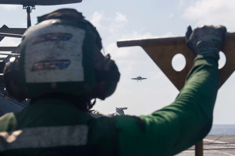 USS Ronald Reagan (CVN 76) conducts flight operations in support of a multi large-deck event with USS Carl Vinson (CVN 70) and Japanese Maritime Self-Defense Force First-in-class helicopter destroyer JS Hyuga (DDH 181)