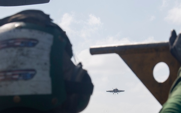 USS Ronald Reagan (CVN 76) conducts flight operations in support of a multi large-deck event with USS Carl Vinson (CVN 70) and Japanese Maritime Self-Defense Force First-in-class helicopter destroyer JS Hyuga (DDH 181)