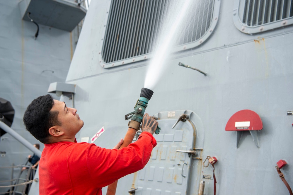 USS Kidd (DDG 100) Sailor Performs Freshwater Wash Down