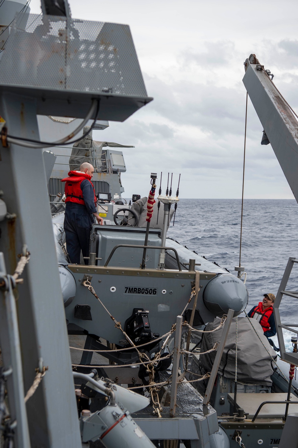 USS Kidd (DDG 100) Sailor Performs Small Boat Maintenance