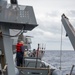 USS Kidd (DDG 100) Sailor Performs Small Boat Maintenance