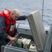 USS Kidd (DDG 100) Sailor Performs Small Boat Maintenance