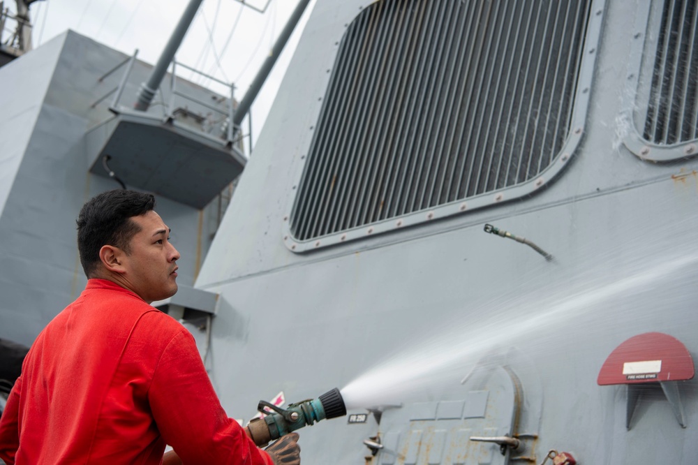 USS Kidd (DDG 100) Sailor Performs Freshwater Wash Down